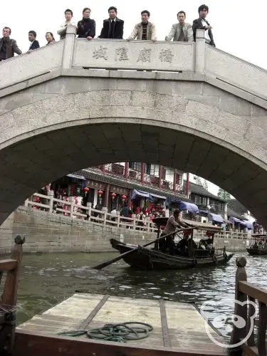 Canal boat ride under a bridge
