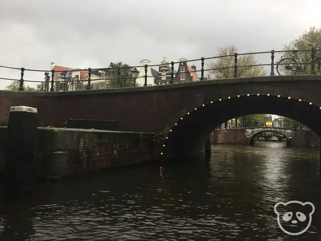 amsterdam-canal-boat-lit-tunnel-canal-houses