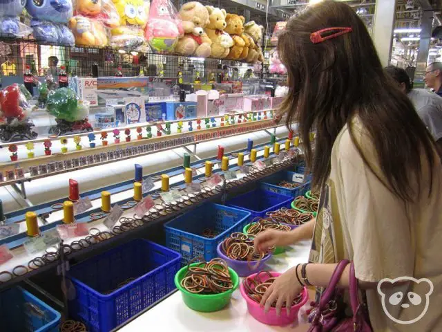 Girl playing arcade games at Shilin Night Market